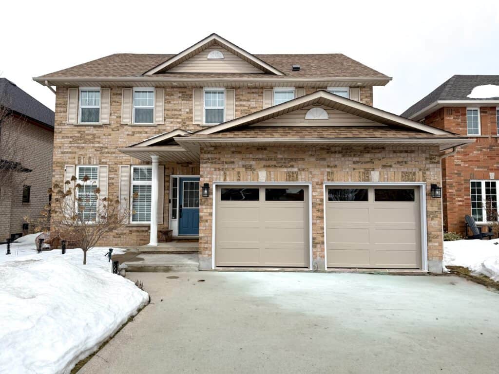 Recessed Panel Taupe Recessed 8x7 Garage Door with tinted windows on top