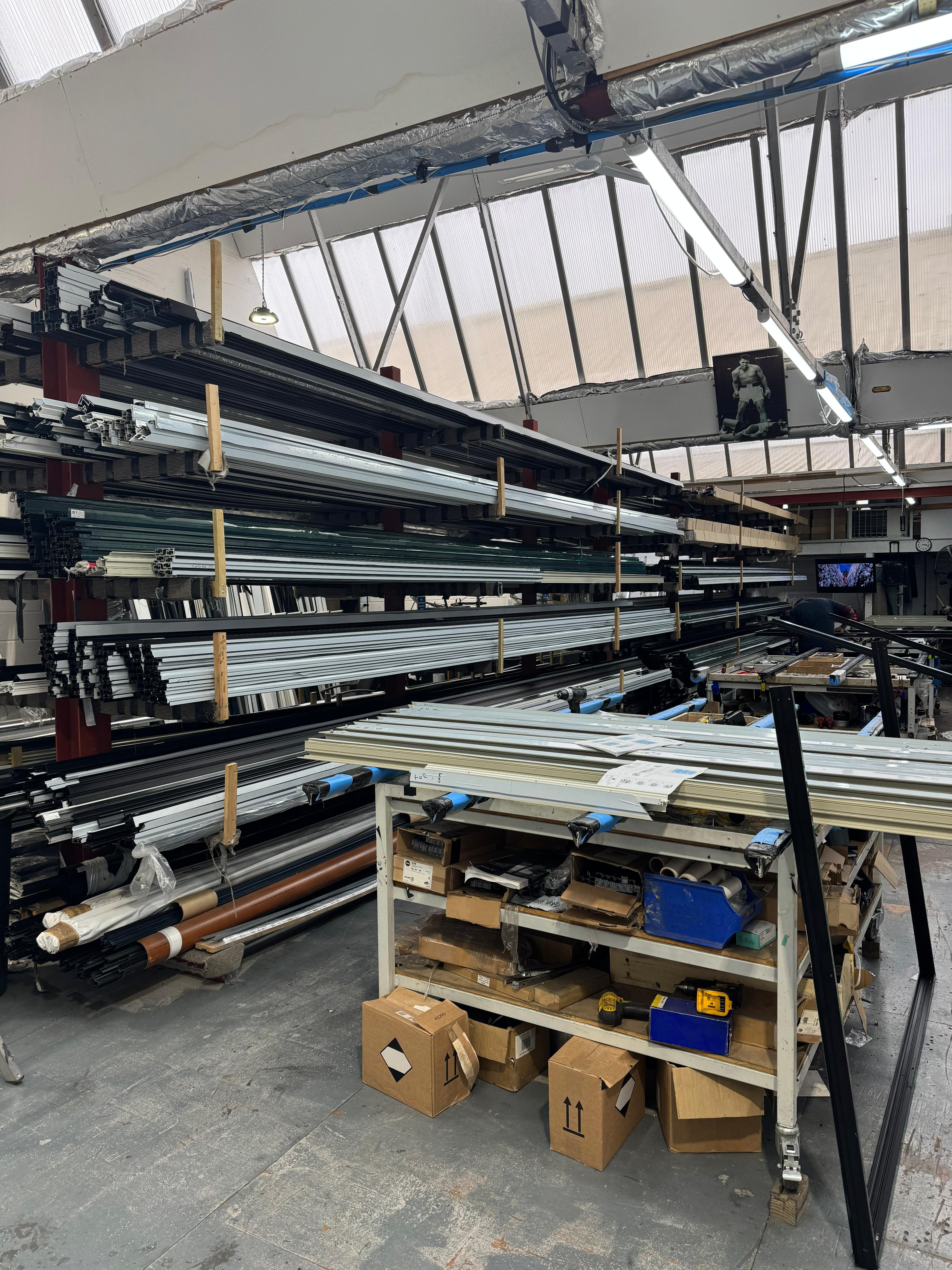 Direct Trade Windows aluminium showroom factory with extrusion profiles in storage