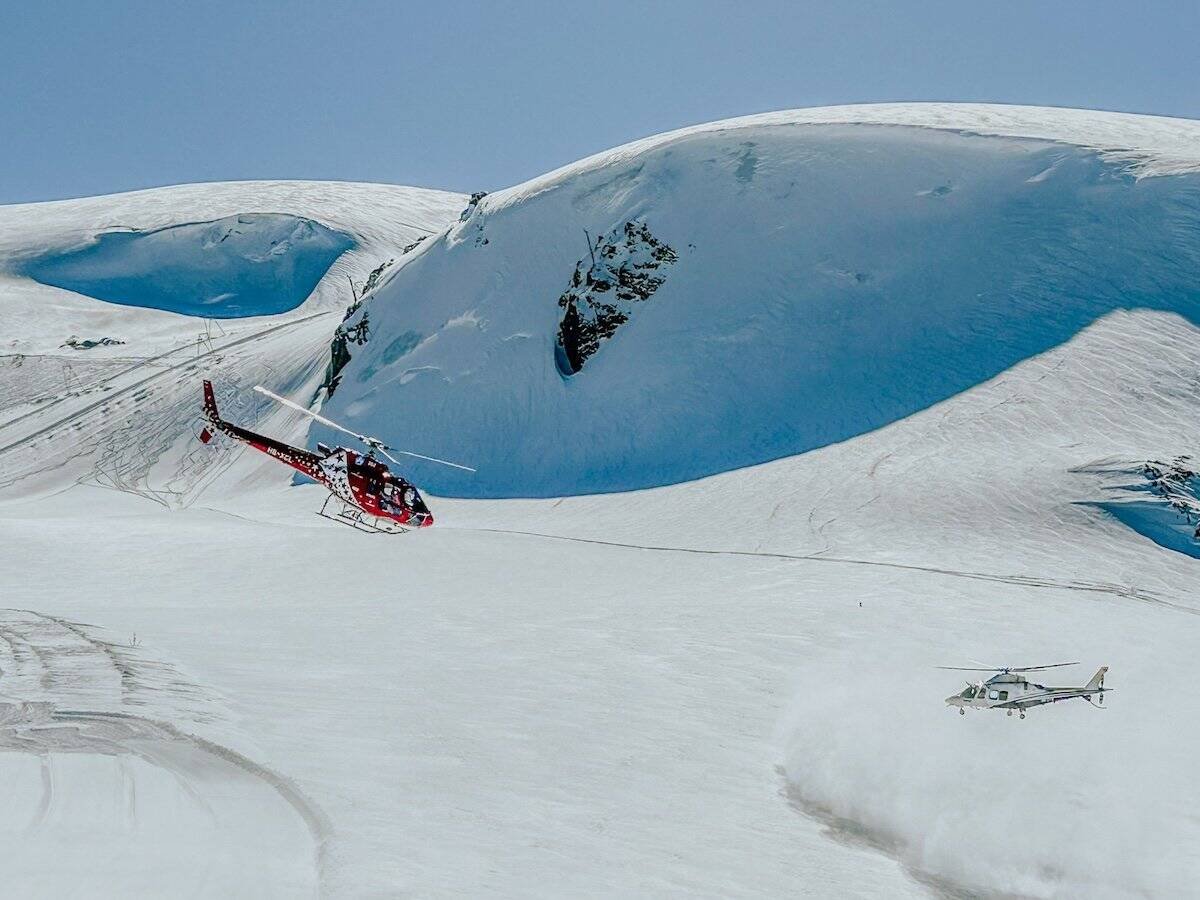 Two helicopters at the side of the piste in Zermatt.