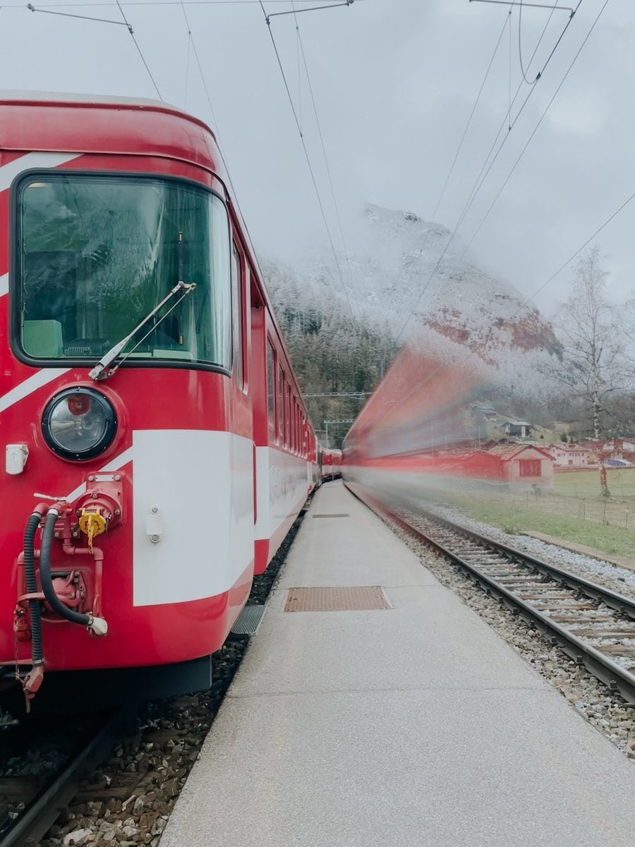 A red train in moody Switzerland.