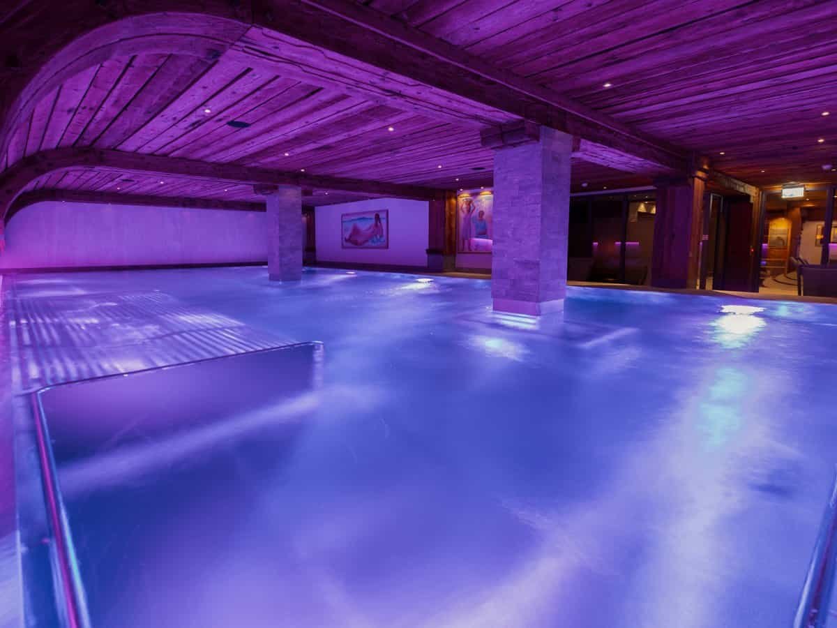 Arca Spa Pool lit in purple in Zermatt