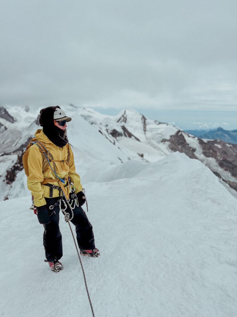 Climber on the summit of Breithorn, Switzerland.