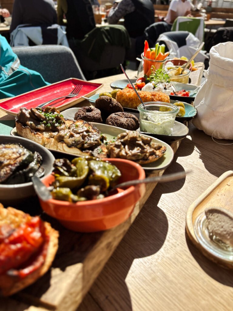 Table filled with a vegetarian sharing platter in Zermatt