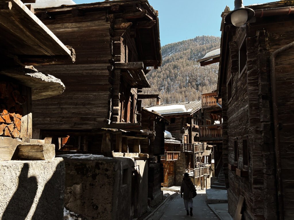 Person walking through Zermatt Old Town