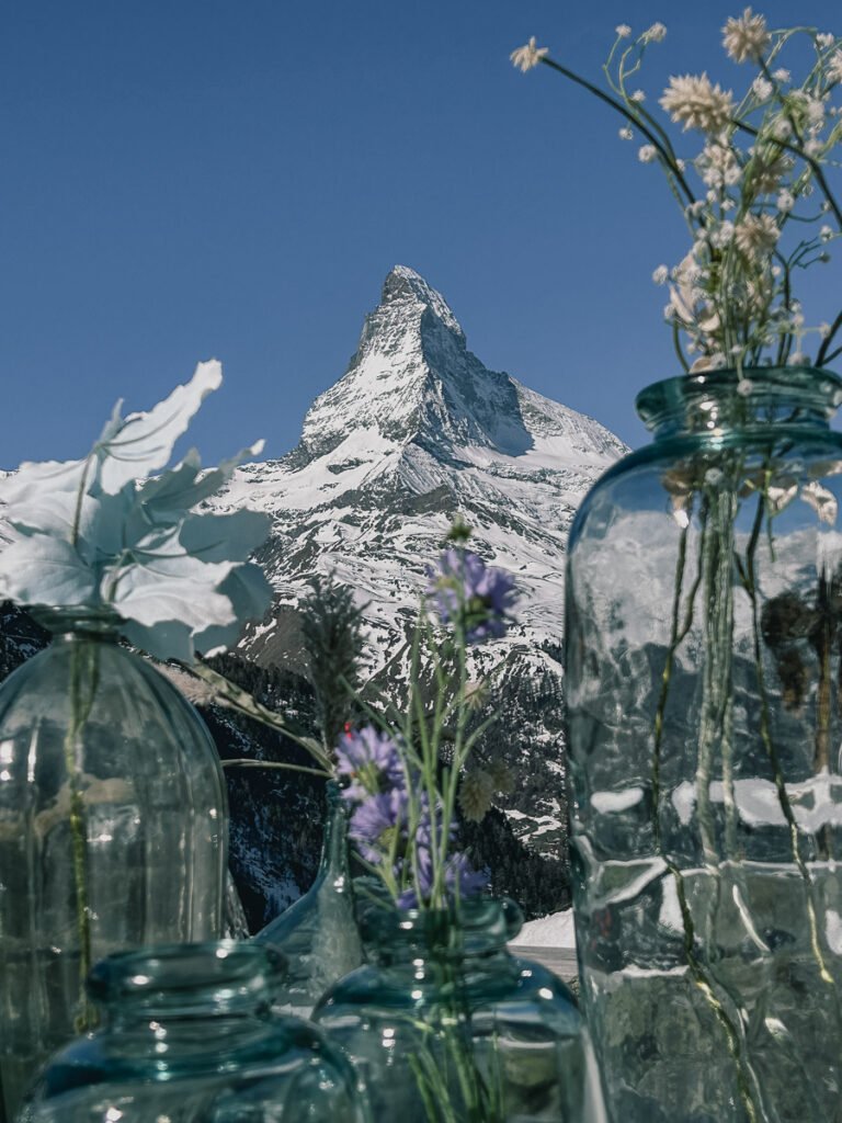 Flowers in jars in front of the Matterhorn.