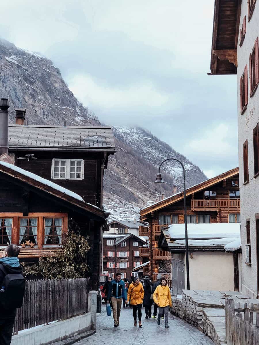 People walking up the street in Zermatt.