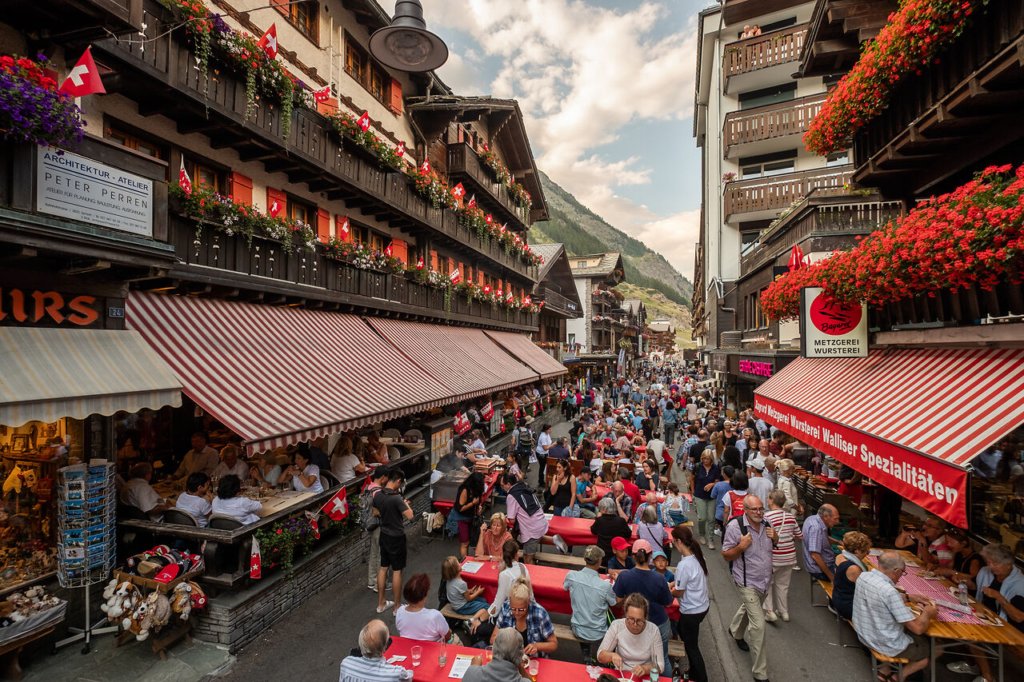 Crowded Zermatt high street on Swiss National Day