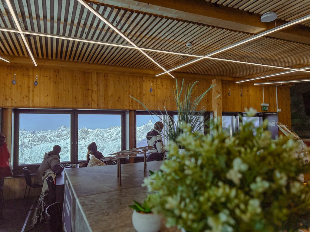 Decor, skiers and mountain views from Matterhorn Glacier Paradise restaurant.