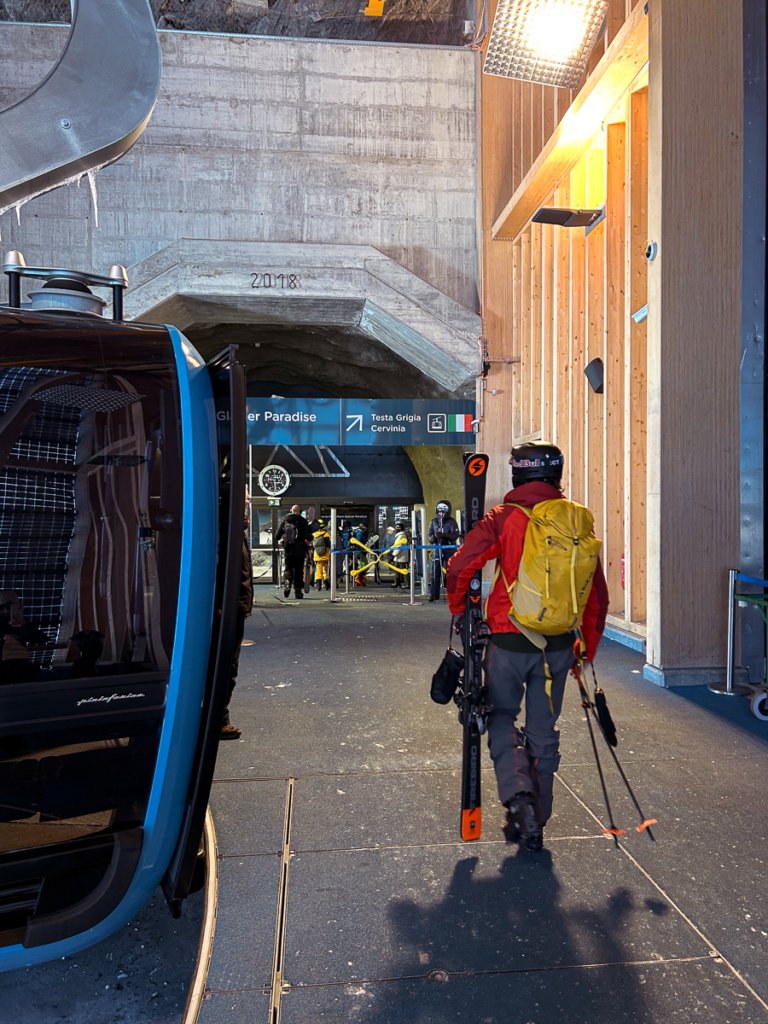 Skier disembarking the gondola at Matterhorn Glacier Paradise.