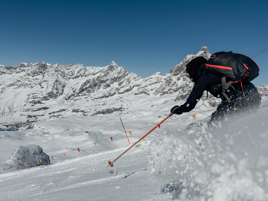 Person spraying snow while skiing in Zermatt and Cervinia.