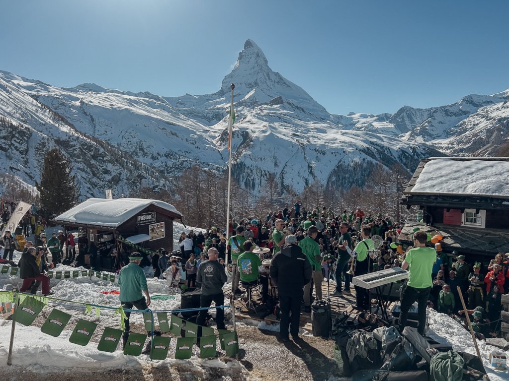 St Patricks day crowd celebrating in front of the Matterhorn in Zermatt.