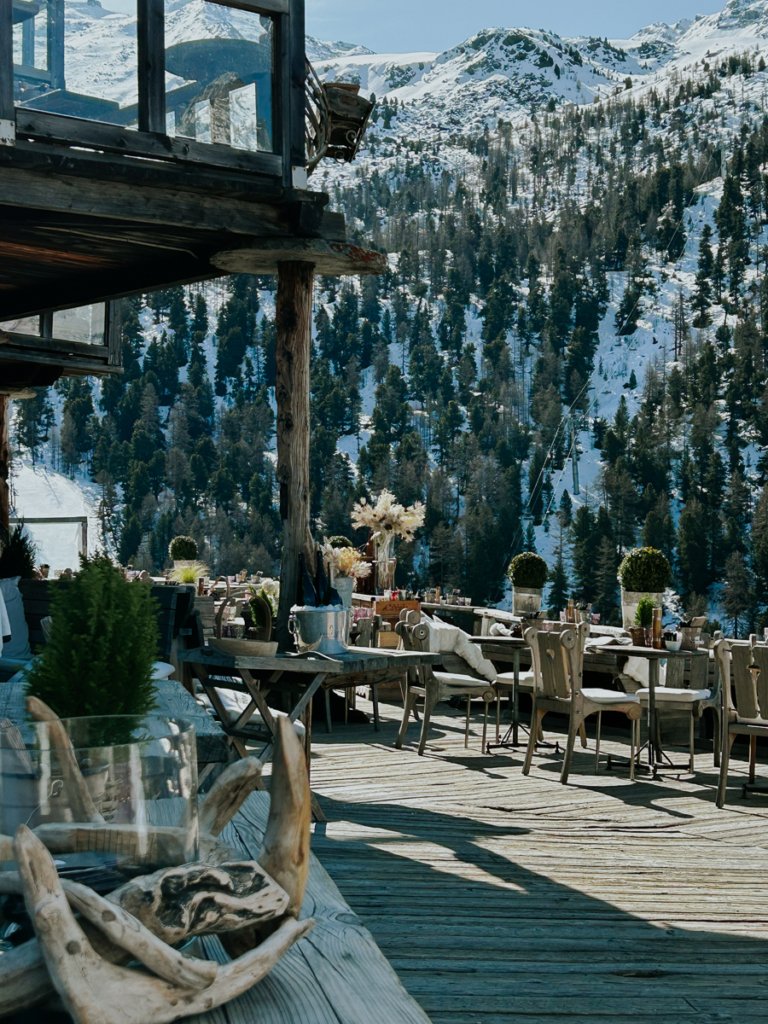 Seating area outside Swiss chalet building, Vrony's in Zermatt.