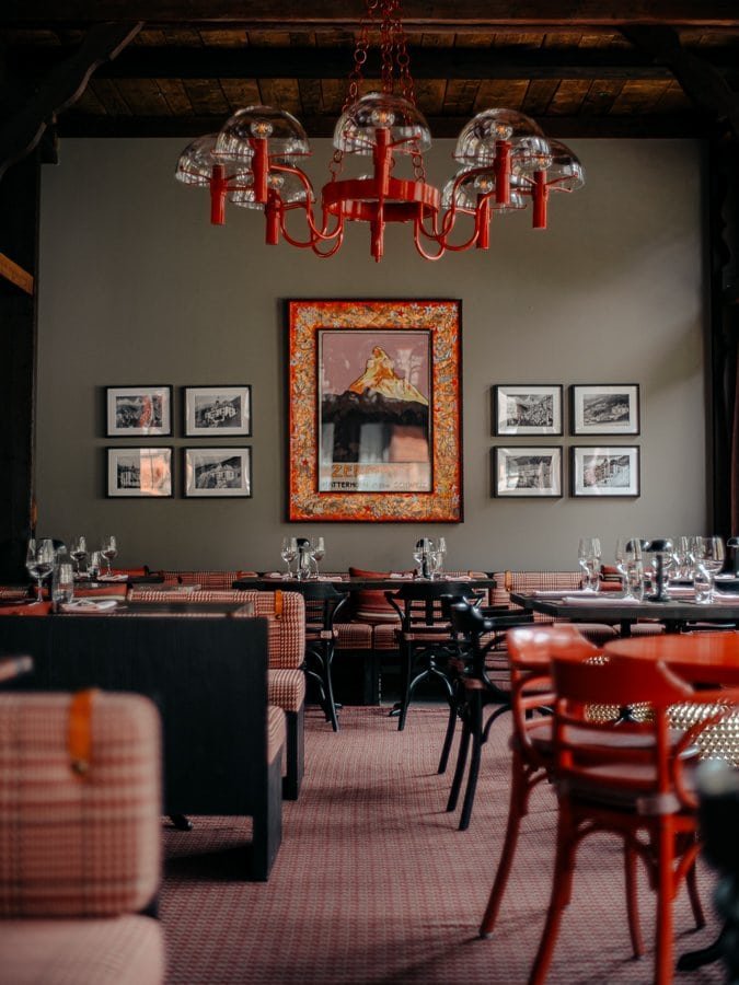Gorgeous, modern green and orange decor at The Grill at BEAUSiTE, Zermatt, Switzerland.