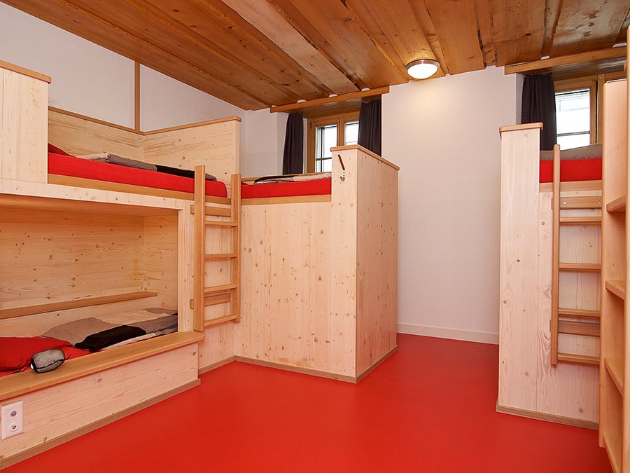 Bunk bed dorm room in a cosy Hostel in Zermatt.