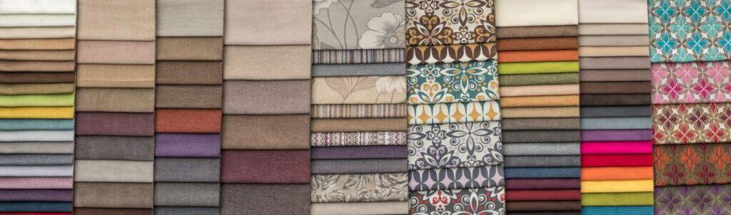 Colorful fabric swatches with floral and geometric designs in various shades.