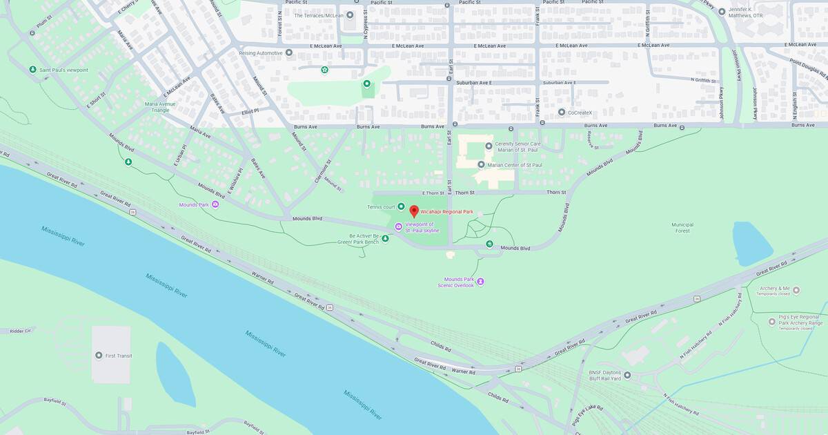 Map showing city park, river, and surrounding streets with landmarks.