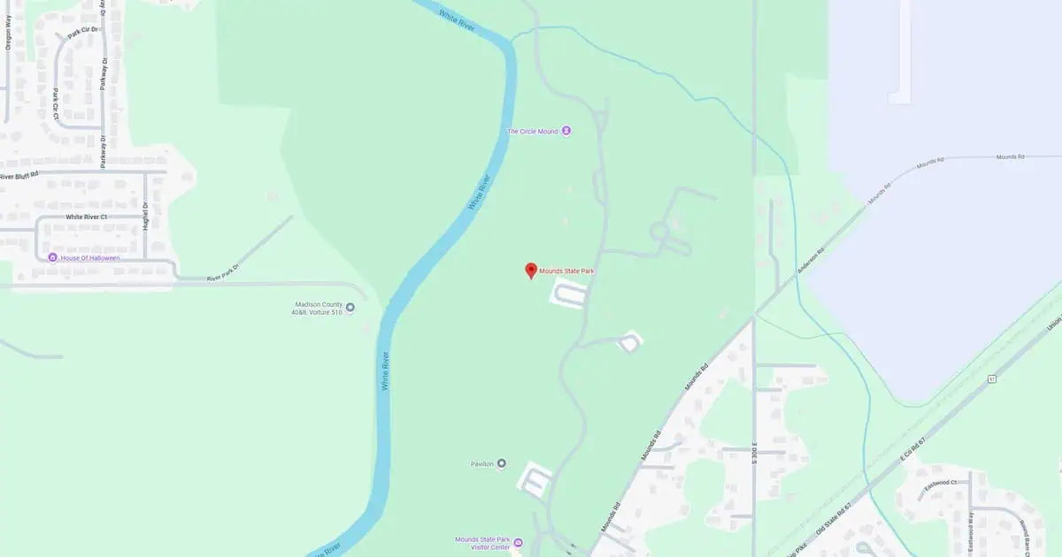 Map of a park showing river, pathways, and surrounding areas.