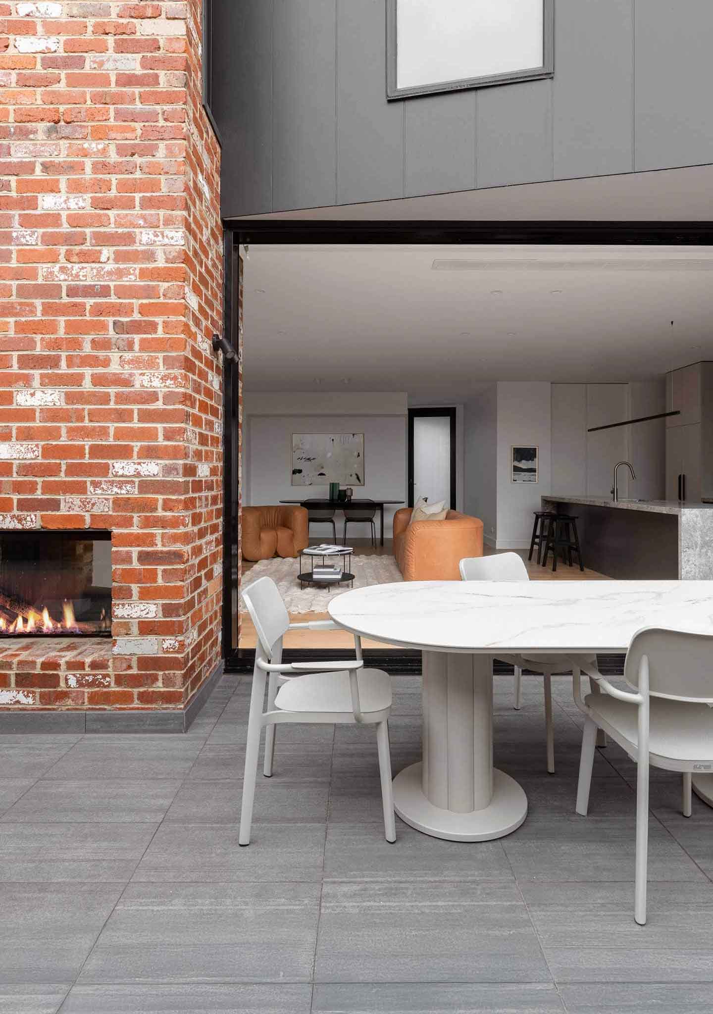 Lotus Dining Table Oval Dining Armchairs Kindred House Glen Iris Megowan Elise Scott Brick Outdoor Fireplace Fire Pit Outdoor dining setting