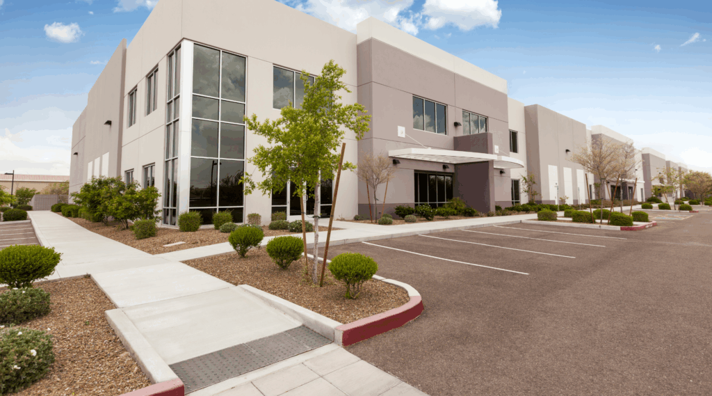 A commercial office building with clean parking spaces. DPM Surface Care