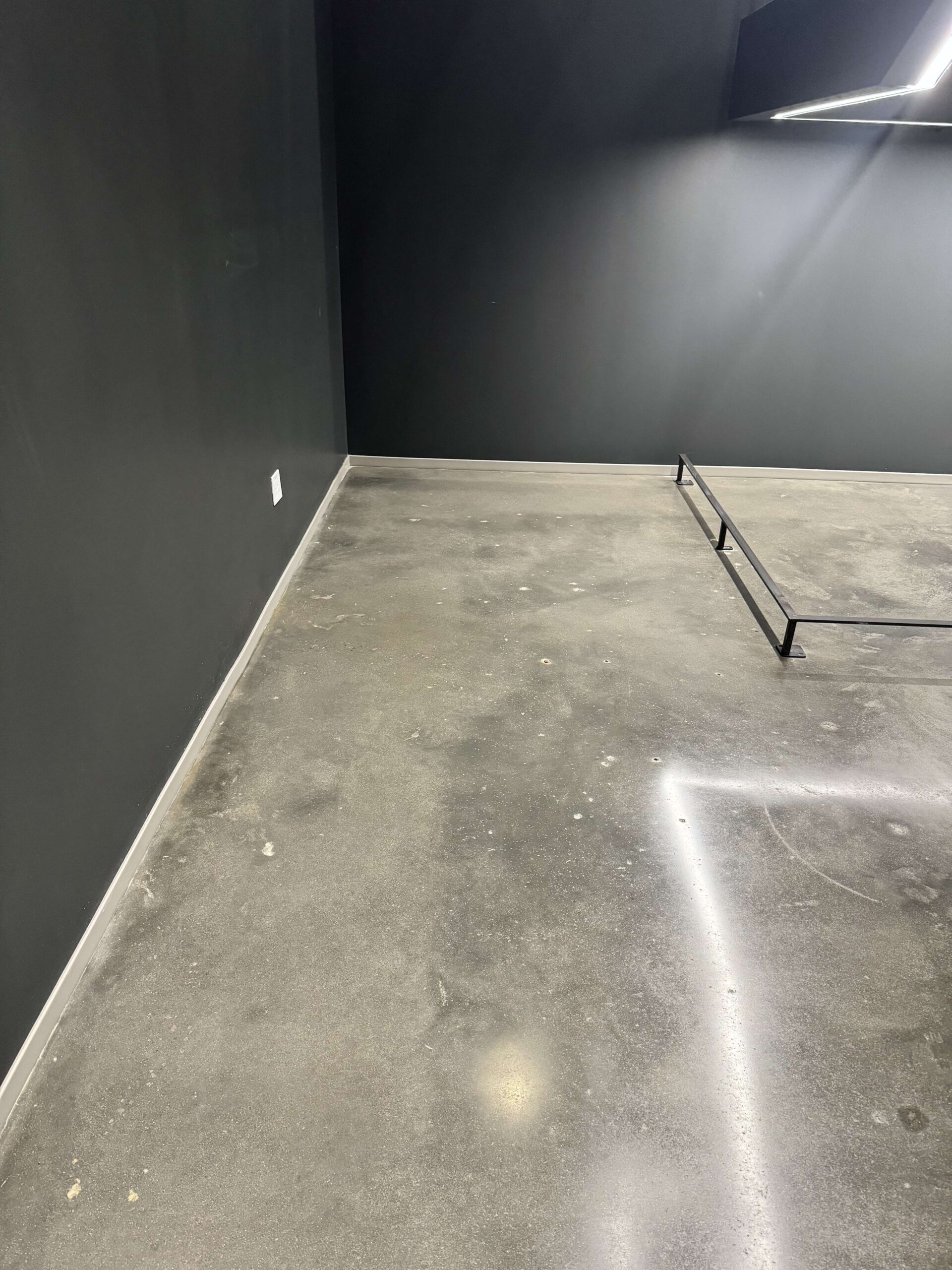 A cleaned concrete floor with water stain removed, after cleaning. DPM Surface Care