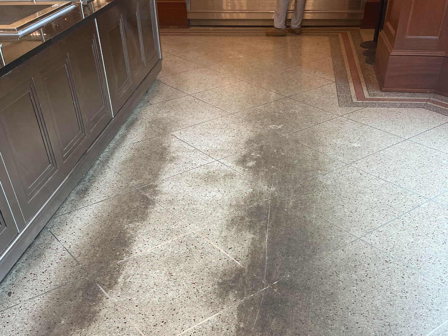 dpm-surface-care-terrazo-before-img A worn and faded terrazzo floors in a commercial office, before terrazzo floor cleaning. DPM Surface Care