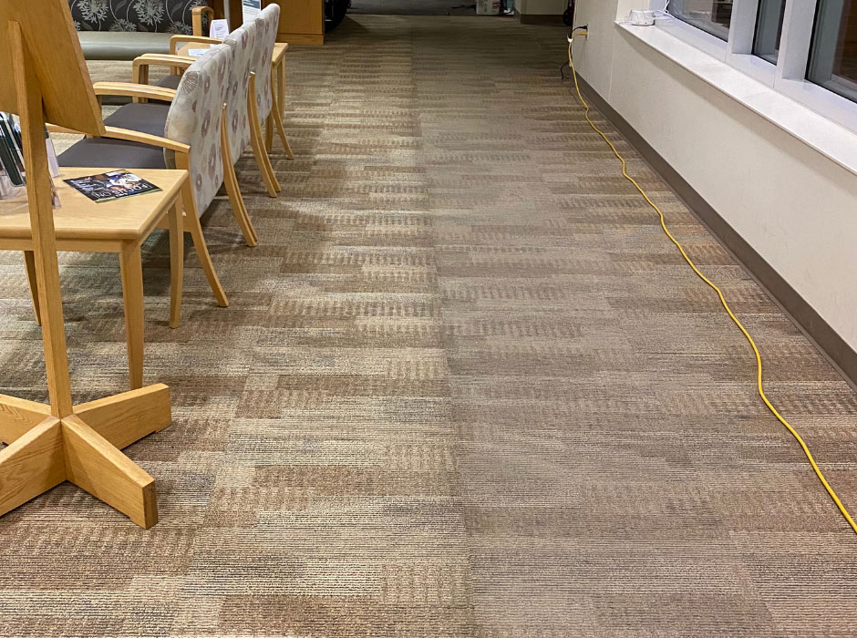 A hallway with carpet in a commercial office. DPM Surface Care - carpet cleaning services