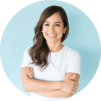 Charming Caucasian woman with arms crossed smiling against colored background | Armin Dental Associates