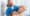 portrait of smiling chiropractor stretching neck