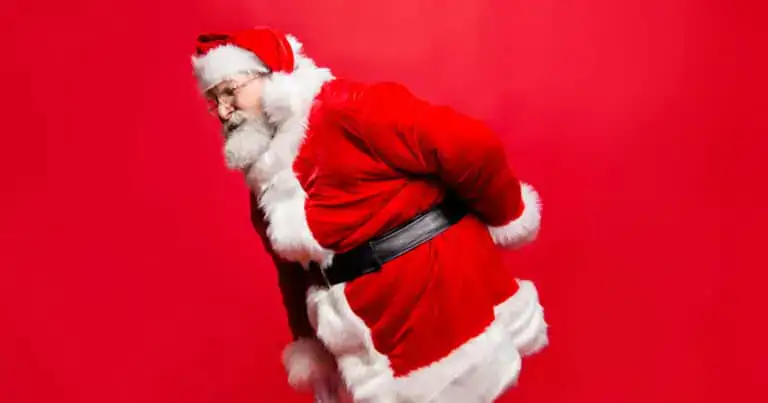 Santa experiencing low back pain, holding his lower back with a pained expression.