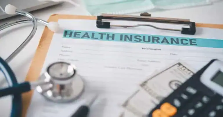 Healthcare insurance form with stethoscope and calculator for coverage tips.