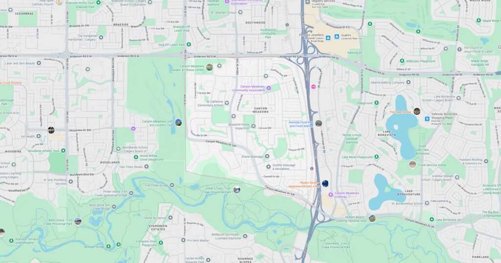 Trail map of urban park with biking paths, lakes, and natural scenery.