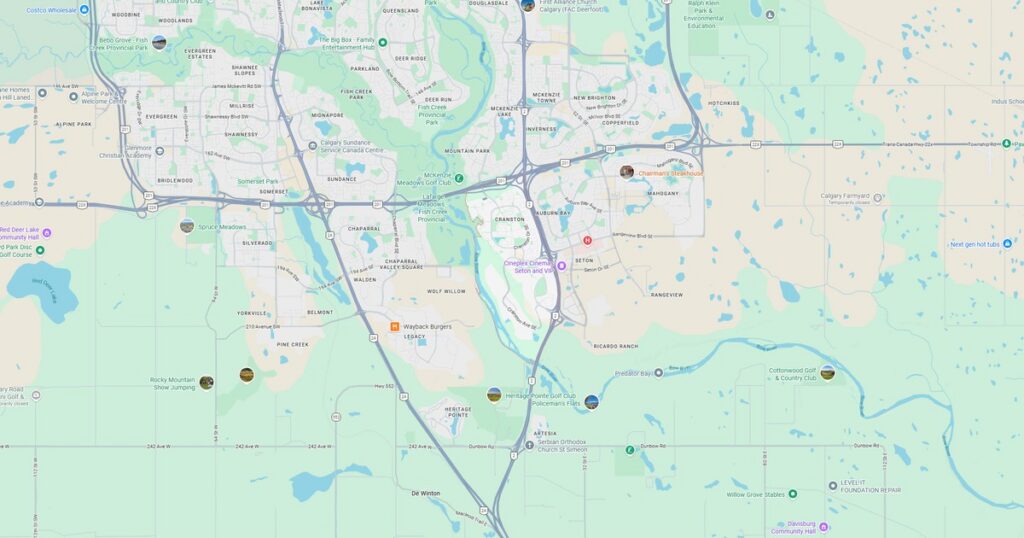 Map of city with river, roads, and landmarks at sunset.