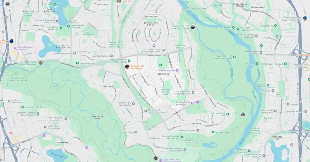 Map of a suburban neighborhood with streets, parks, and water bodies.