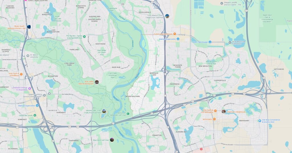 Map showing city streets, green parks, and water bodies for navigation.