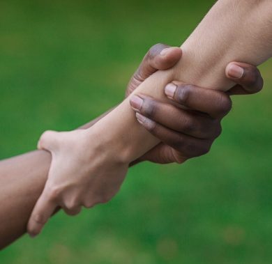 Multiethnic friends helping hand outdoor, copy space Multiethnic friends helping hand outdoor, copy space