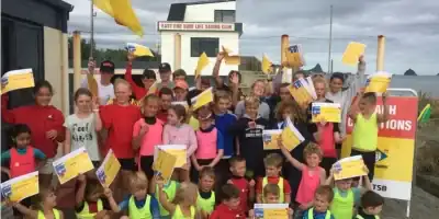 Kids enjoying surf lifesaving activities at East End Surf Life Saving Club, a safe beach for families and water safety education.
