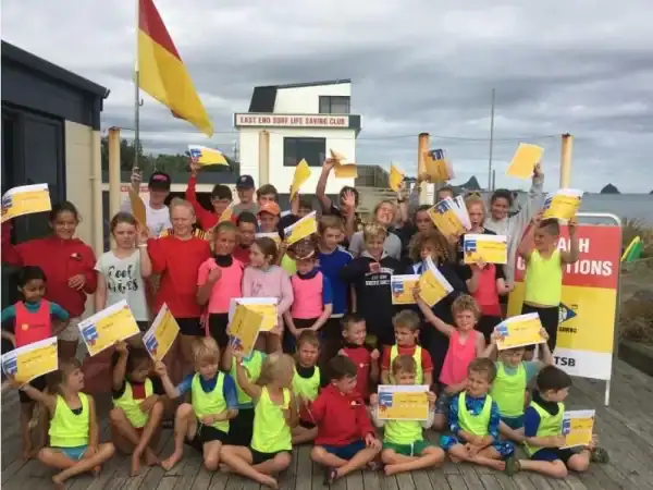 Kids enjoying surf lifesaving activities at East End Surf Life Saving Club, a safe beach for families and water safety education.