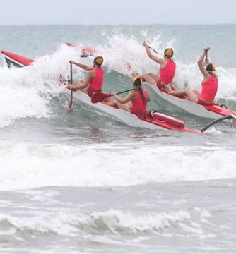 East End Surf Life Saving Club members racing on surf skis.