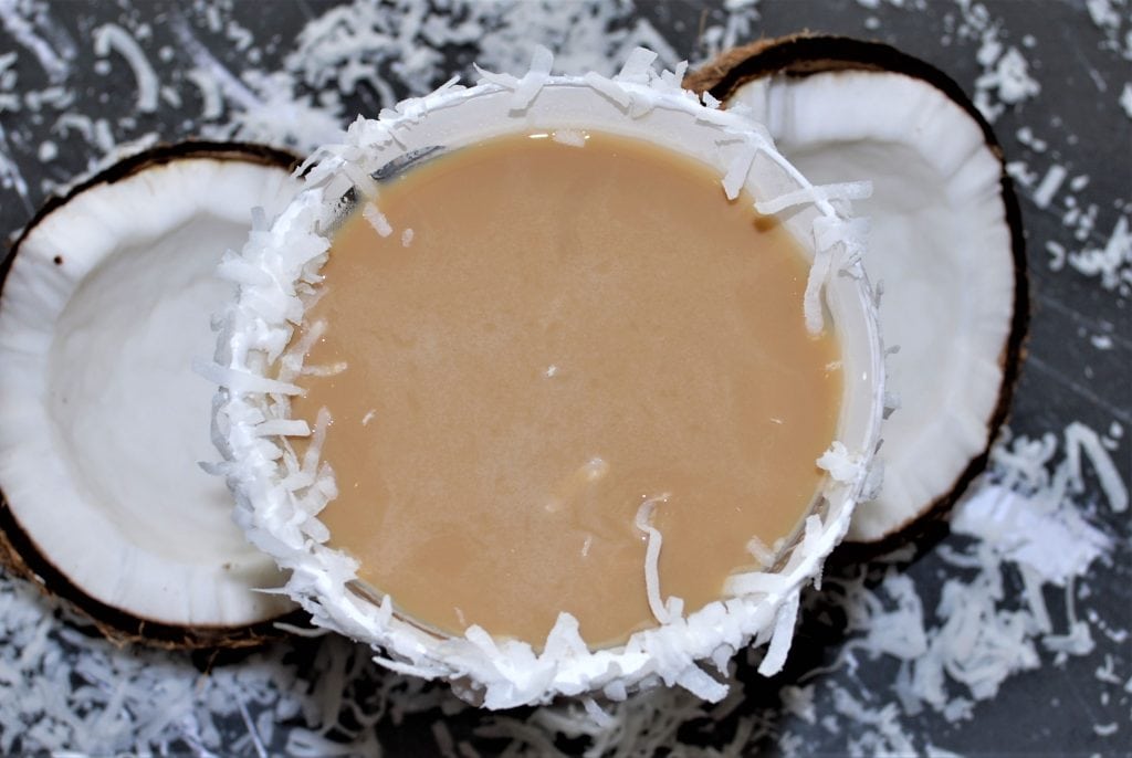 Coconut Espresso Martini with a shredded coconut rim