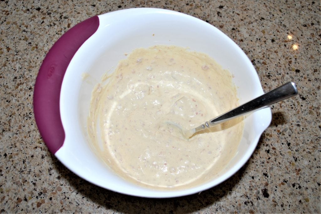 Mayonnaise and mustard in a small bowl