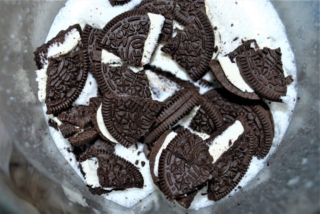 Broken Oreo Cookies in a blender with vodka, Junket Ice Cream Mix, milk, and heavy cream.
