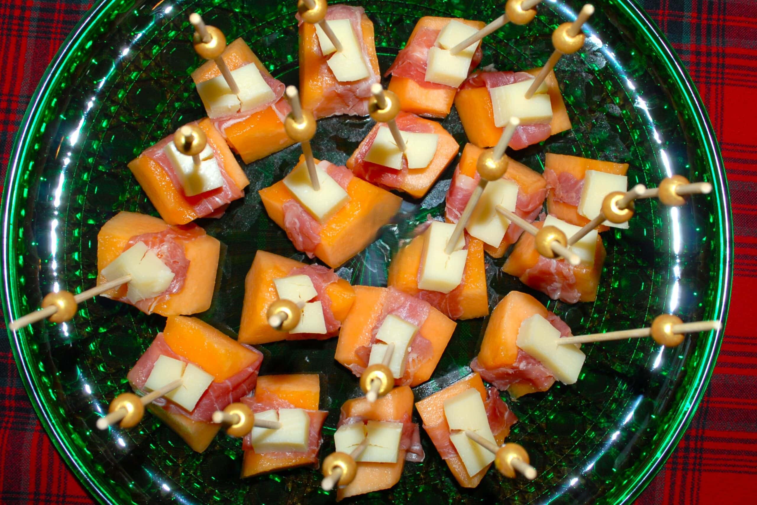 Melon chunks wrapped with prosciutto and parmesan chunks