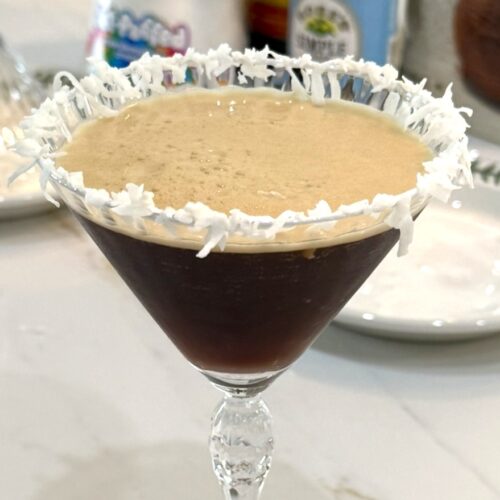 Coconut Espresso Martini with a coconut flake rim