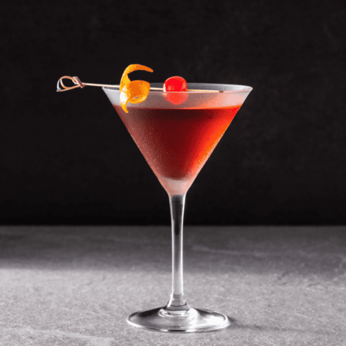 Manhattan with an orange twist and cherry