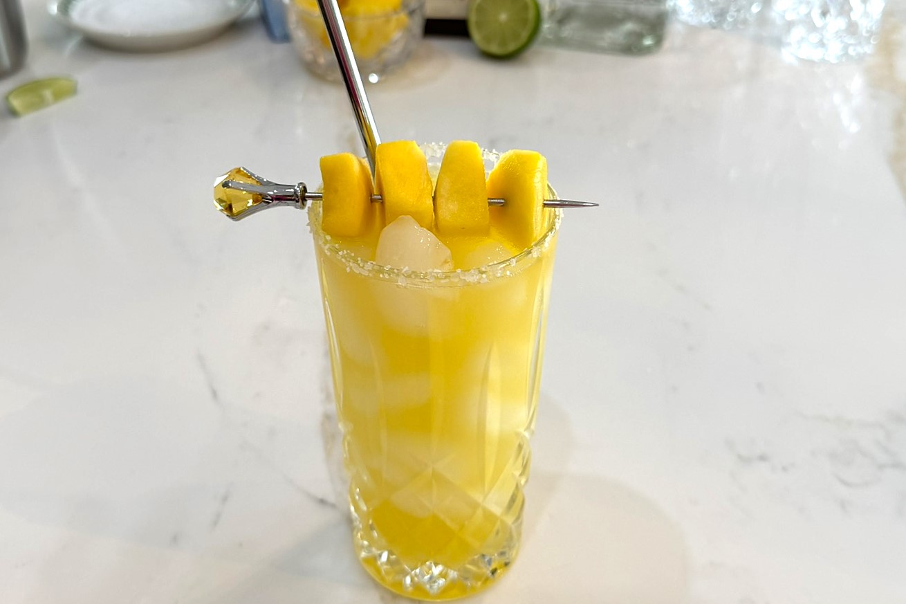 Mango Margarita garnished with chunks of mango