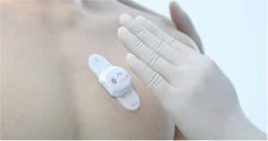 Applying a home ECG Holter monitor to the chest for private heart testing