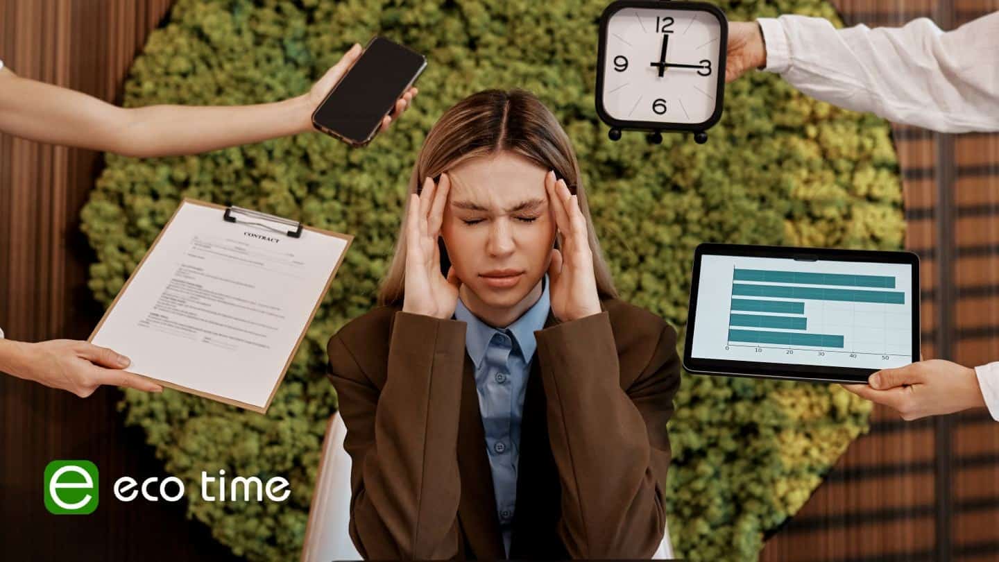 Businesswoman stressed with multiple work tasks and deadlines.