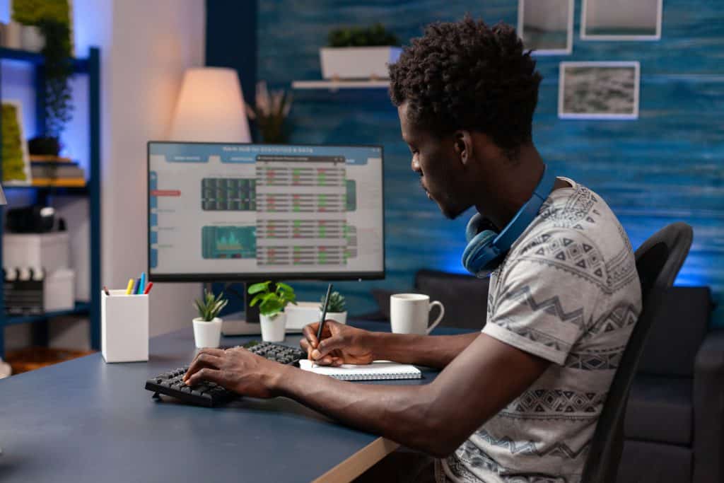 african american young trader writing crypto earni 2021 10 12 05 20 35 utc