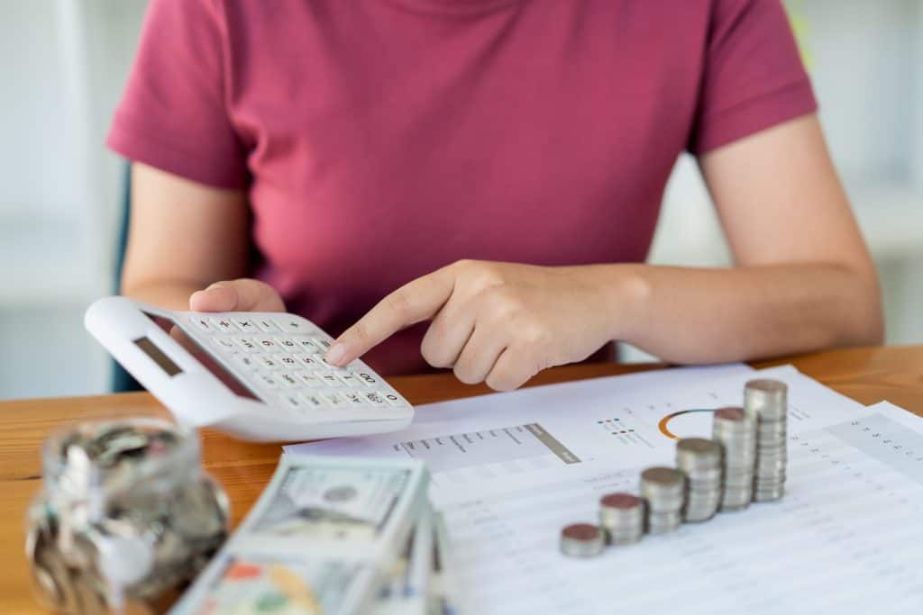 saving concept the woman in a red top calculating 2022 11 07 10 10 02 utc