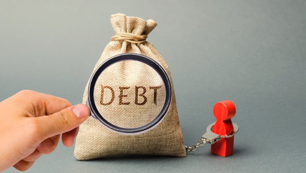 money bag with the word debt and a human figurine 2022 11 09 06 36 37 utc min
